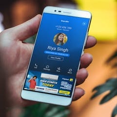 a phone showing the truecaller app with an ad