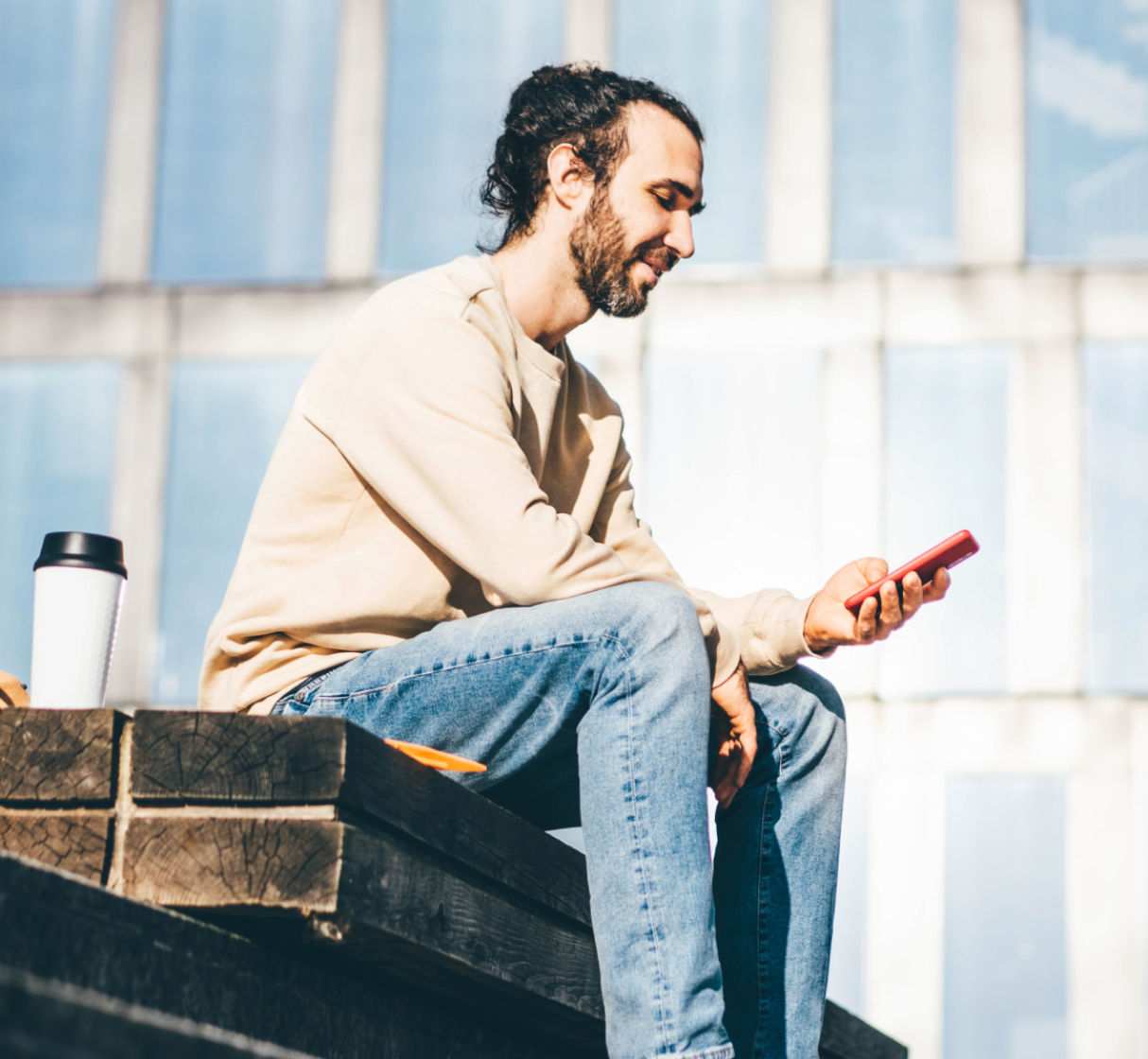 man sitting on the floor and texting