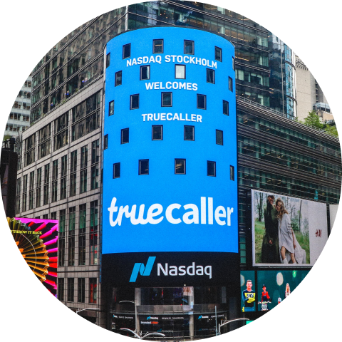 the nasdaq billboard on Times Square showing the truecaller logotype along with "Nasdaq Stockholm Welcomes Truecaller"